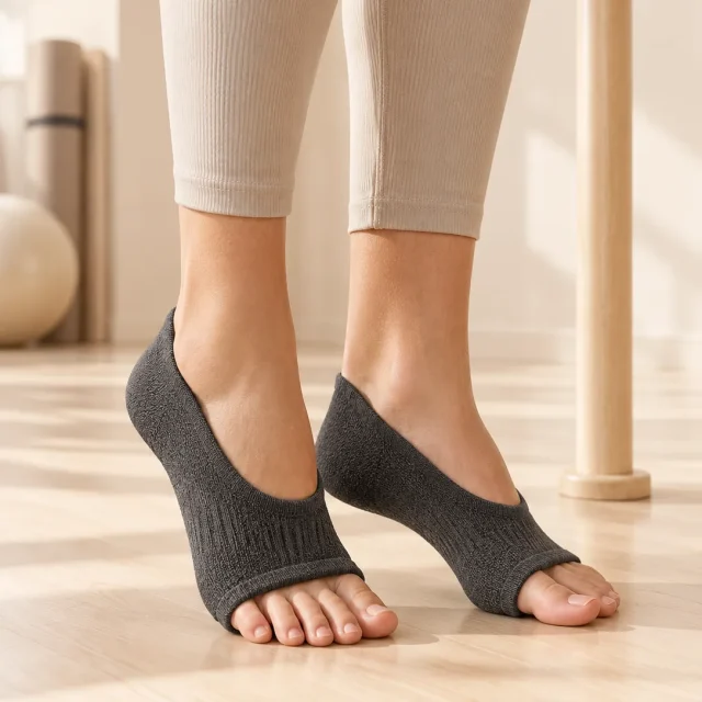Whorl Toeless Grip Socks in the studio